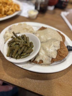 Chicken fried steak with mash potatoes and gravy
