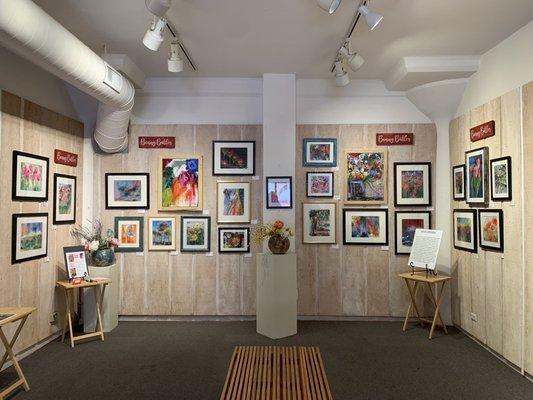 Photos on the mezzanine level of featured artist Bonny Butler, June 2022.