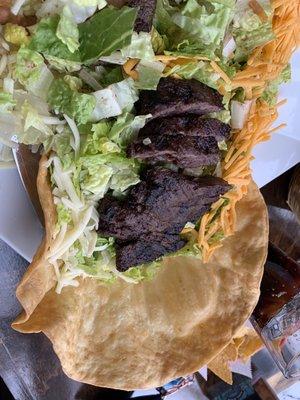 Tostada salad with steak