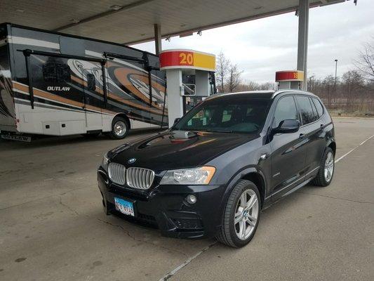 That BMW X3 sure looks great next to that gas pump!