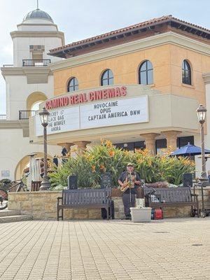 Enjoying the marketplace entertainment on a sunny (finally!) winter day.