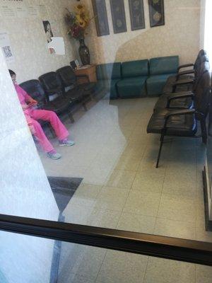 Nurse browsing on her phone, ignoring me standing outside for almost an hour with no patients inside the waiting room