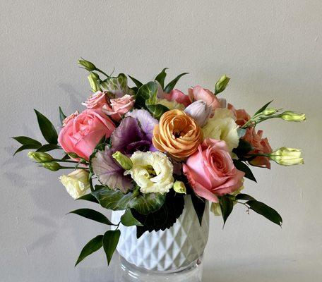 Low lush mounded arrangement in ceramic.