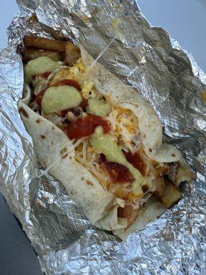 Potato, Bacon, Egg & Cheese on a Flour tortilla.