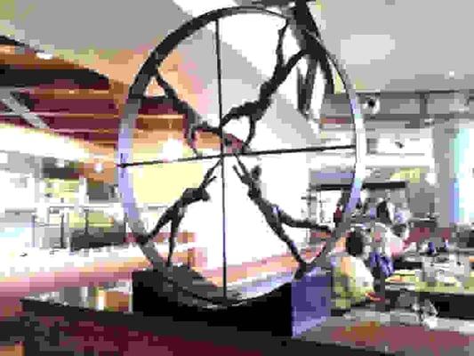 Cool piece of artwork. FYI - men don't make the world go round.