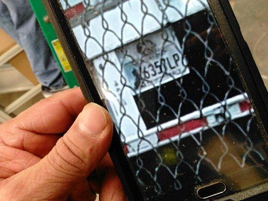 The Turr Transport truck that hit my car in hiding behind the chain link fence.