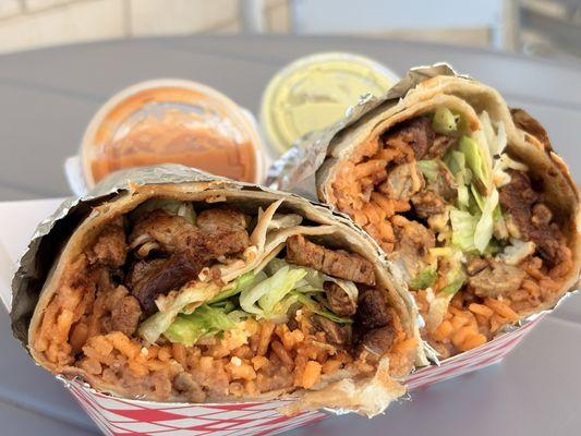 Burrito - Bisteak with mexican rice, refried beans, lettuce. Red and Green Salsa