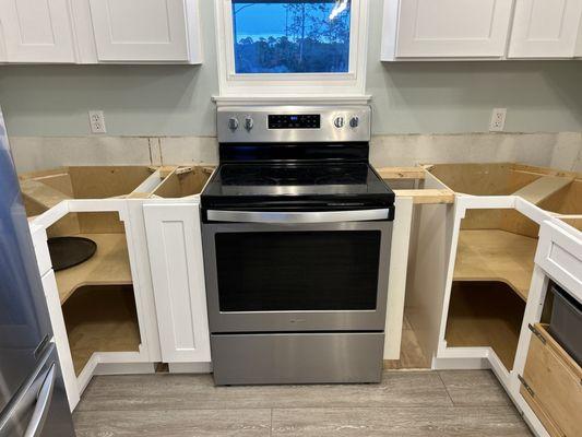 They eventually got the stove centered to the window after our project had sat idle for half of the month of January 2024.