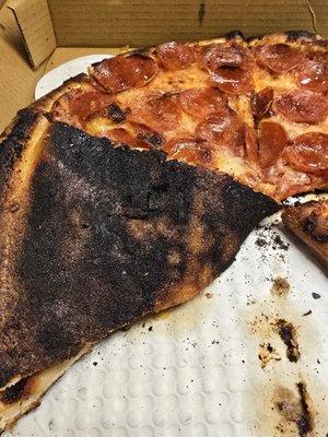 Burnt and gross pepperoni pizza