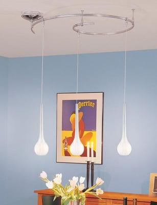 beautiful monorail with pendants provide lighting for dining room.