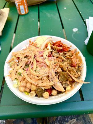 Chicken and Lamb over Rice with Lettuce, Cucumber, Chickpeas, Pickled Onion, Feta Cheese, Hummus, and Spicy White Sauce
