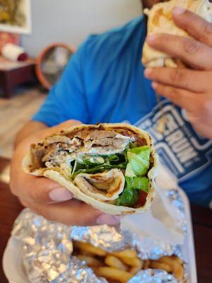 Gyro with a side of fries.