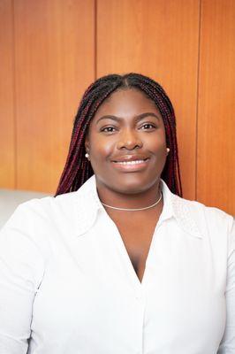 Meet Jonique, our warm and welcoming receptionist -- she's always here to help with a smile!