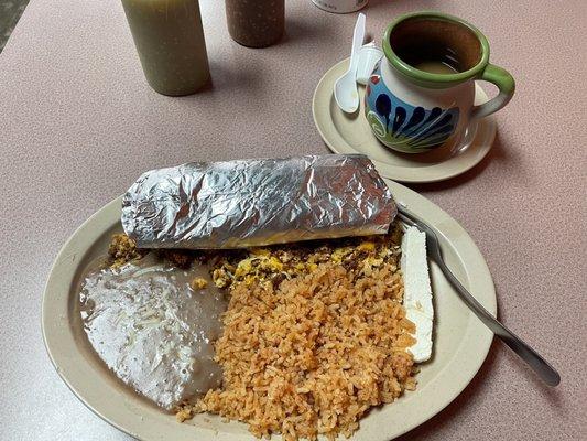 Chorizo and eggs with fresh tortillas, beans and rice.