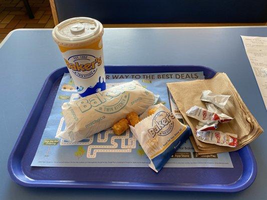 Steak and egg breakfast burrito, tater tots, medium iced tea