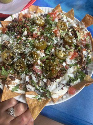 Beef and chorizo nachos with everything