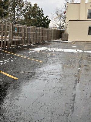 Plowing and salting parking lots.