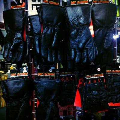 Large assortment of gloves and helmets