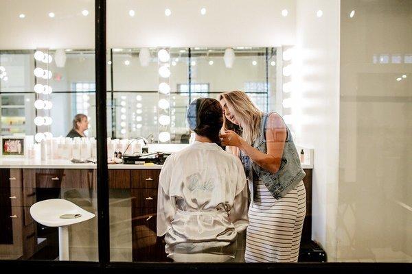 Katrina doing makeup for a bride