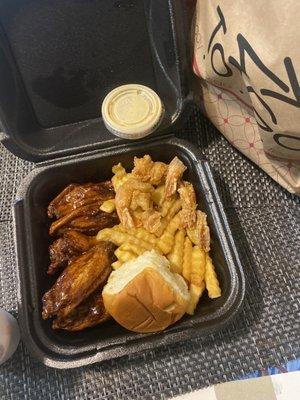 The trap box 6 wings, 6 shrimp, and fries