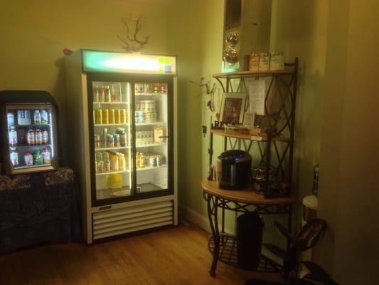 Coffee bar and fridges. Stocked with items such as Kombucha, yerbe mate,etc