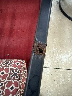 Patio chairs, rusty arms