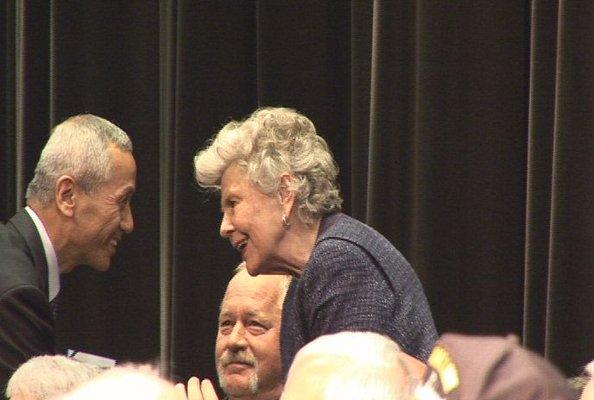 Mrs. George W. Patton accepts Ambassador for Peace Medal from Korea's Consul General.