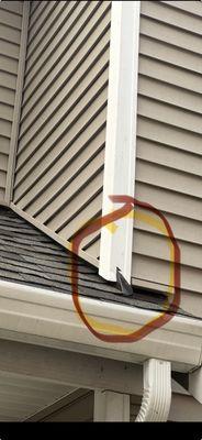 That's a piece of metal flashing to divert the water down the roof and not toward the bottom of that window.