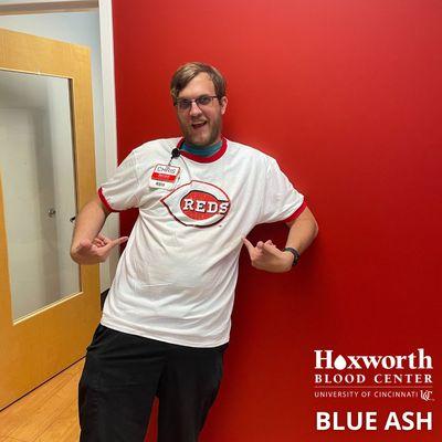 Phlebotomist wearing July Reds promotion.