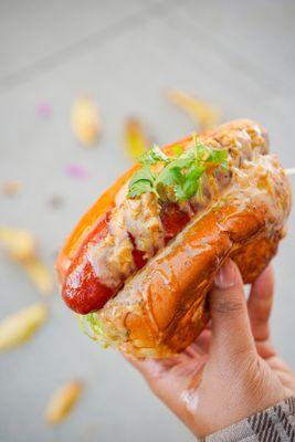 Spicy Sausage Roll - lettuce, pickled veg, onions, house creamy, mustard, garlic butter sauce