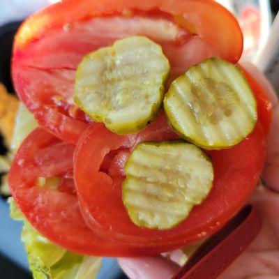 I hate pickles, made sure to ask if it came with anything other than lettuce & tomatoes. Even asked no pickles or onions? Bartender said No.