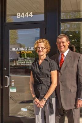 Owners Mark and Joan Haas in front of west side office.