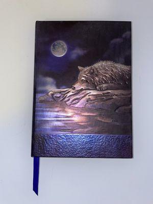 Notebook with no lines. I use it for art. They have leather notebooks too. :-)