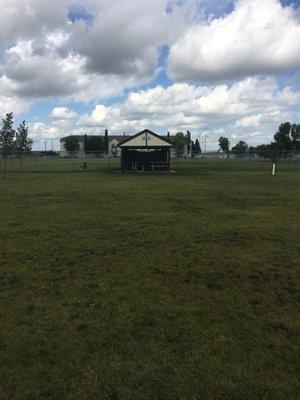 Divided shelter area. Half on big dog side, half on little dog side.