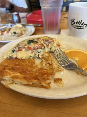 Omelette with bacon, spinach, onions, tomatoes, jack cheese