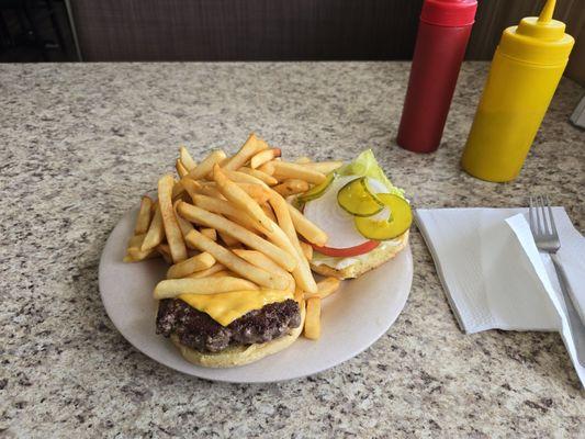 Cheeseburger with a mound of fries.
