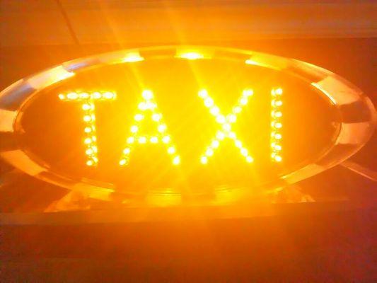 Taxi for hire, top lite in my office.