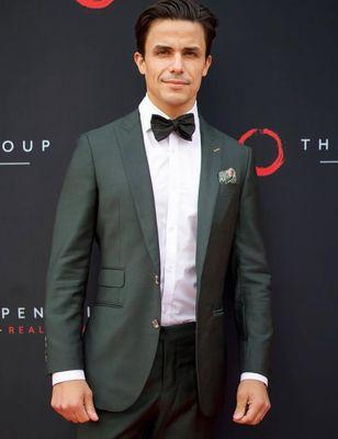 Selling OC Star Gio Helou looking dapper in a custom suit from The Grotto Menswear