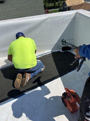 Roof repair building up a section for proper drainage