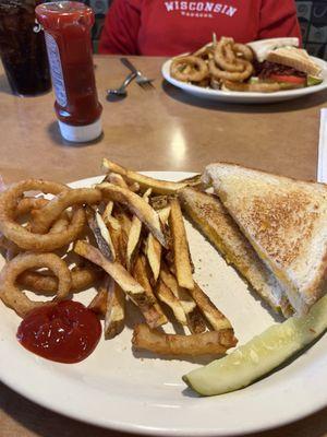 Grilled cheese, fresh cut fries, onion rings. Junior club on the back plate.
