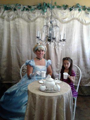 Have a 10-minute tea party with Cinderella for only $10 you get a cup set in a photo
