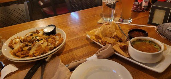 Loaded waffle fries, spinach and artichoke dip