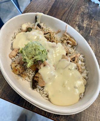 Build your own bowl - Spicy Chicken, brown rice, green peppers, queso, quac, chipotle crema