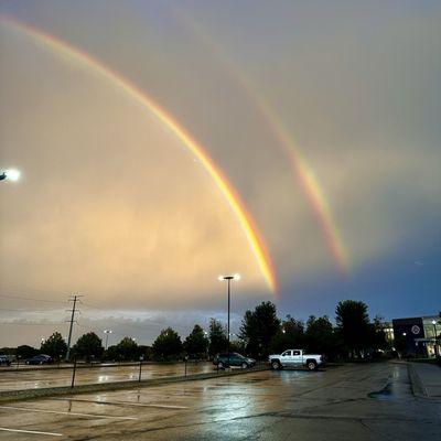 leaving work one day I noticed the sky had an odd hew to it and I turned around and saw the most beautiful sky w/almost matching rainbows.