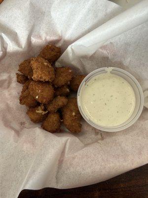 Spicy cheese curds with dipping sauce.