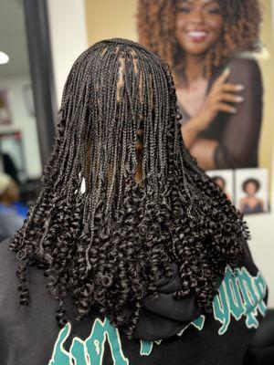 Small knotless braids with curly ends