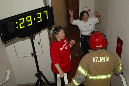 OnSite 911 staff cheering on the winner of the Firefighter climb at the Bank of America building.