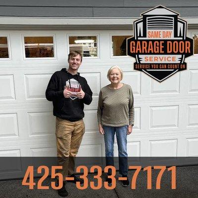 Satisfied customer showing their new garage door