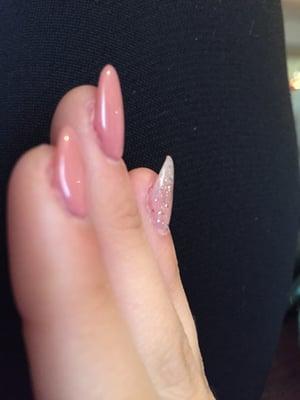 Crooked nails by Tiffany I asked for an oval shape and she filed my nail too much on one side and refuses to fix it