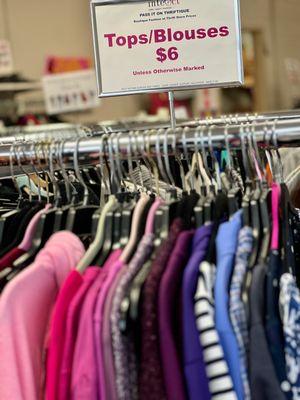 Clothing options include jackets, pants, jeans, shoes, blouses, shirts, coats, and more at Pass it On Thrift Store.
